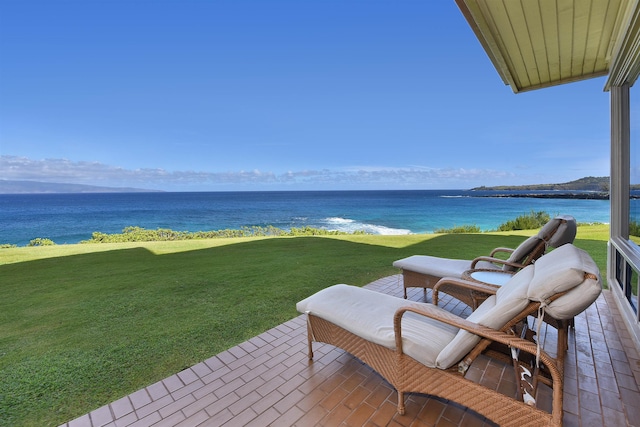 view of patio with a water view