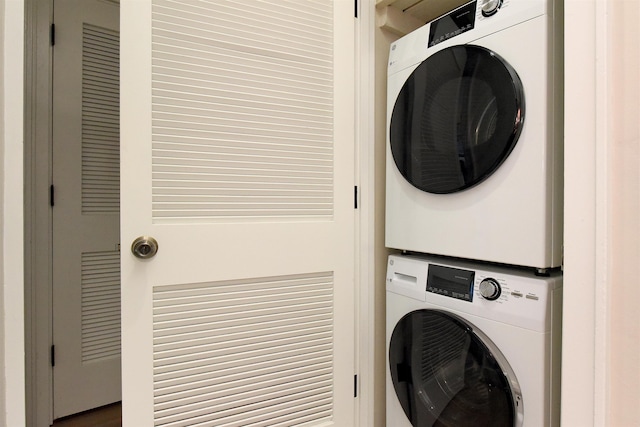 laundry area with stacked washing maching and dryer