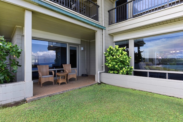 view of yard featuring a patio area and a balcony