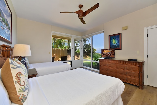 bedroom with ceiling fan and light wood-type flooring