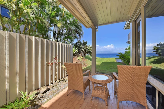 view of patio / terrace with a water view