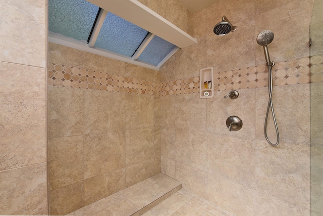 bathroom with tiled shower