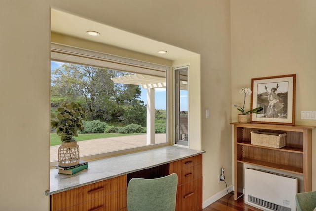 office area with dark wood-style floors, recessed lighting, heating unit, and baseboards