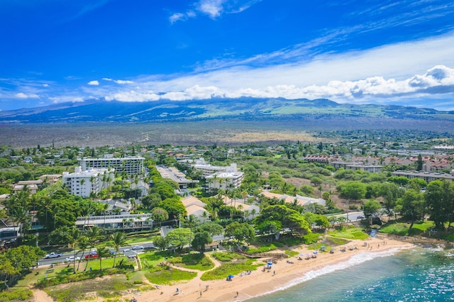 aerial view featuring a beach view and a water and mountain view