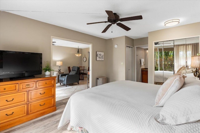 bedroom with access to outside, ceiling fan, and light hardwood / wood-style floors