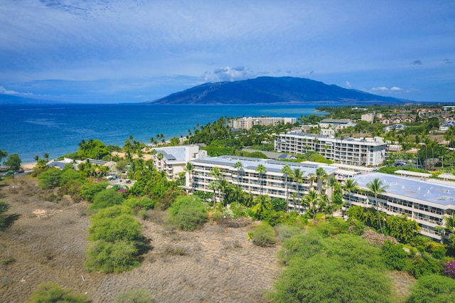 bird's eye view with a water and mountain view