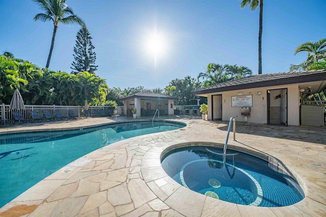 view of swimming pool with a community hot tub and a patio