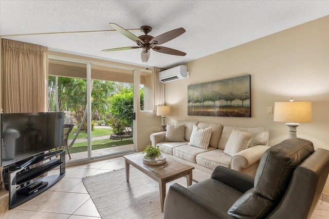 living room featuring light tile patterned floors, a textured ceiling, an AC wall unit, and ceiling fan