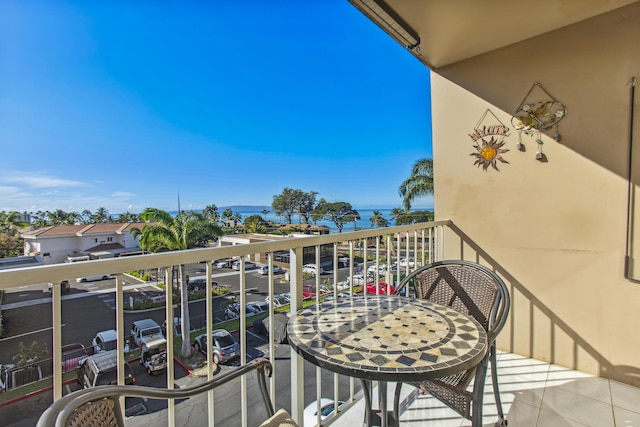 balcony featuring a water view