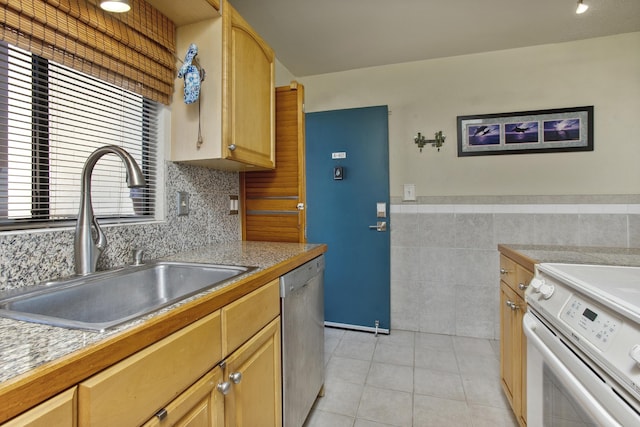 kitchen featuring light tile patterned flooring, light brown cabinetry, dishwasher, white range with electric cooktop, and sink