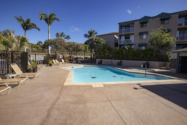 view of swimming pool with a patio area