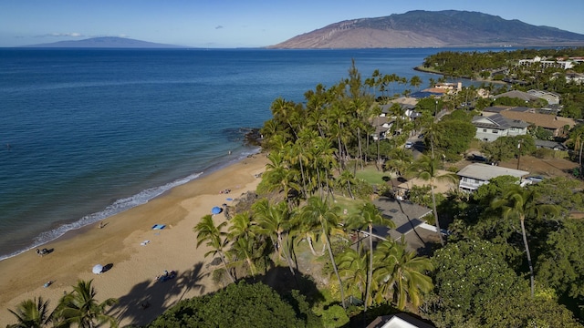 bird's eye view with a water and mountain view and a view of the beach