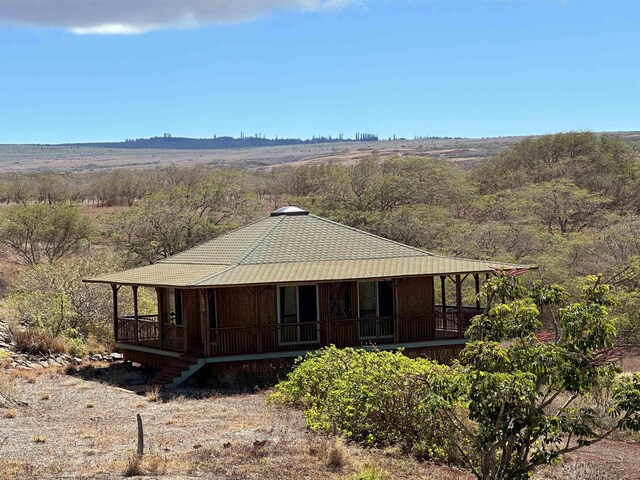 wooden terrace with a rural view