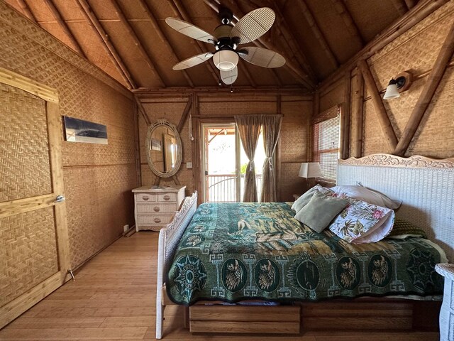 living room featuring high vaulted ceiling, ceiling fan, beamed ceiling, and wood-type flooring