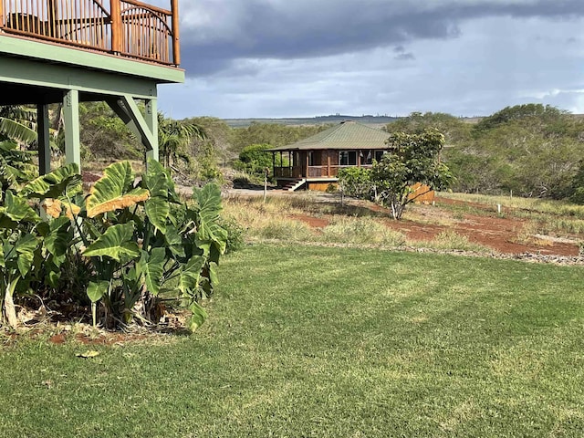 view of yard featuring a wooden deck