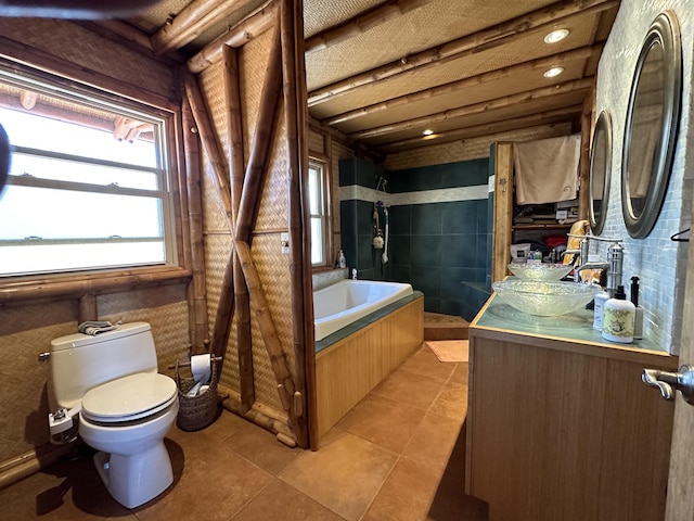 full bath with toilet, a garden tub, tile patterned floors, and vanity