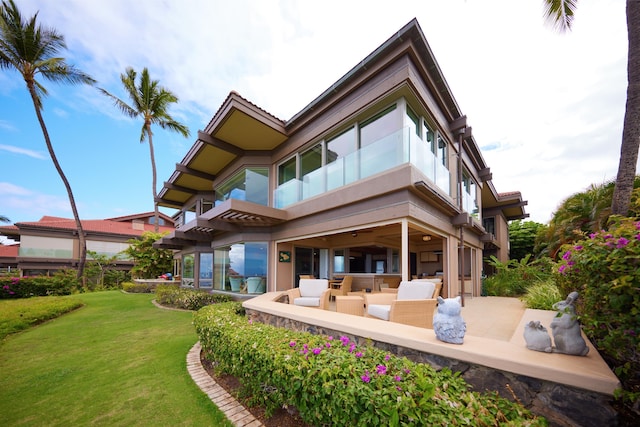 4000 Wailea Alanui Dr Unit 3003, Kihei, HI 96753 - back of house with a lawn, stucco siding, a patio area, and outdoor lounge area