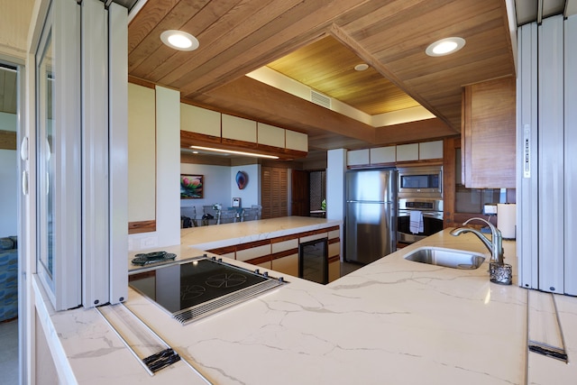 4000 Wailea Alanui Dr Unit 3003, Kihei, HI 96753 - kitchen featuring stainless steel appliances, wooden ceiling, wine cooler, recessed lighting, and light stone counters