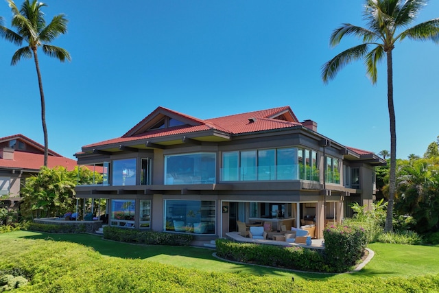 4000 Wailea Alanui Dr Unit 3003, Kihei, HI 96753 - back of house featuring a yard, a patio area, a chimney, and stucco siding