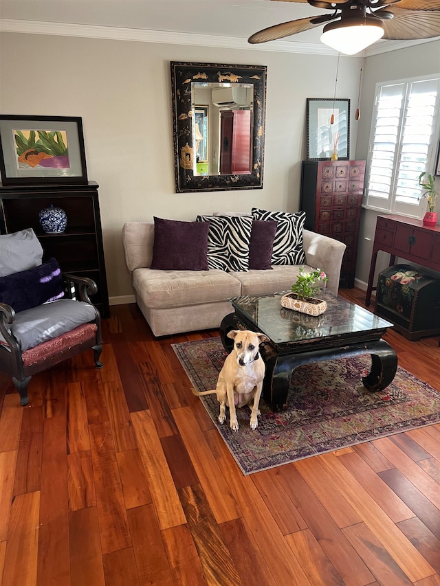 living room featuring ceiling fan, crown molding, and hardwood / wood-style floors