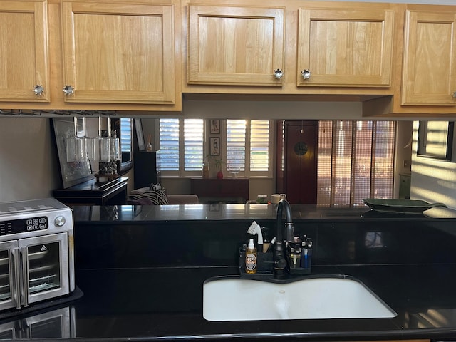 kitchen with light brown cabinets and sink