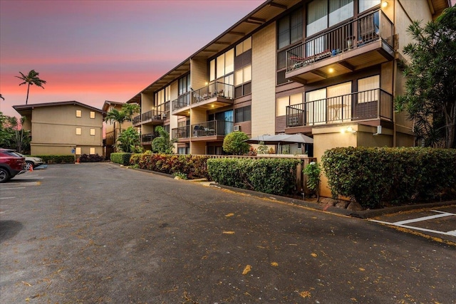view of outdoor building at dusk