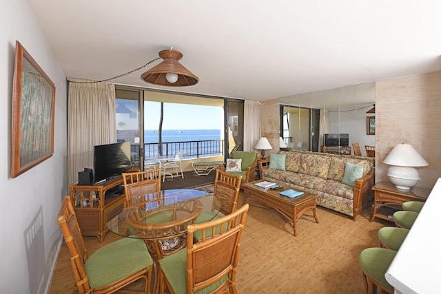 living room with hardwood / wood-style floors and expansive windows