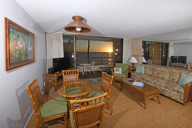 living room with lofted ceiling and hardwood / wood-style flooring