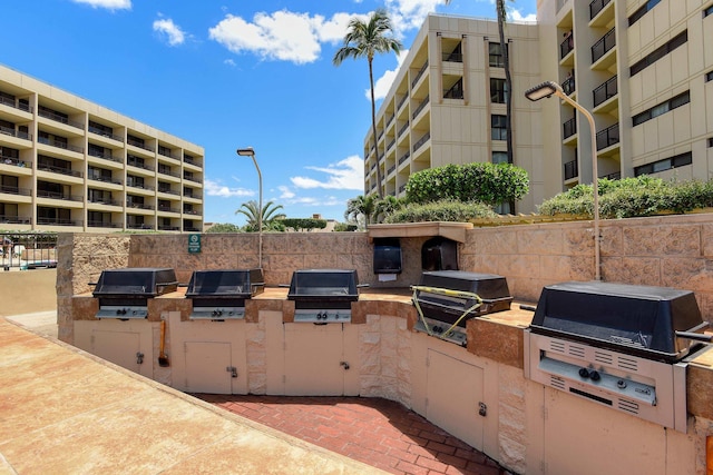 view of patio / terrace featuring a grill and exterior kitchen