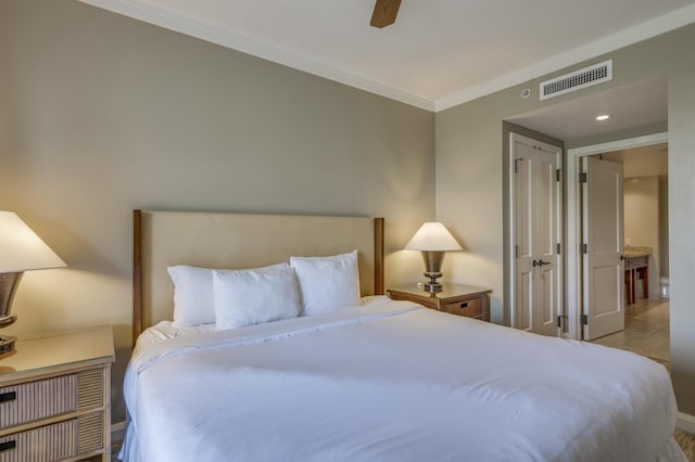 bedroom with ceiling fan, light tile patterned floors, and crown molding