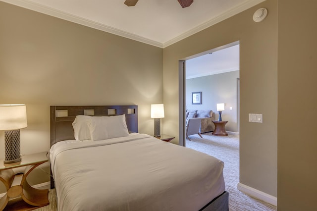 bedroom featuring carpet floors, ornamental molding, and ceiling fan