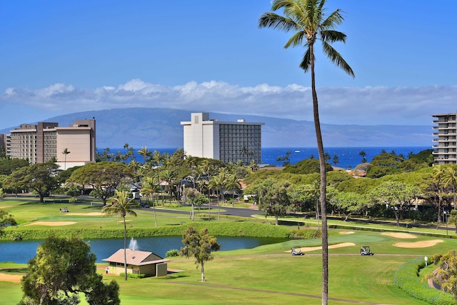 view of property's community featuring a water view and a yard