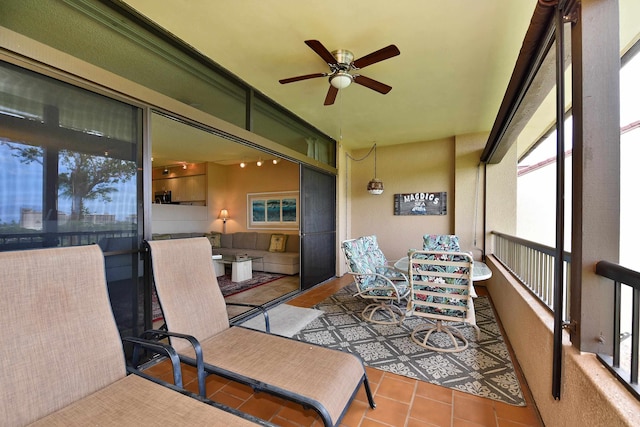 sunroom / solarium with ceiling fan