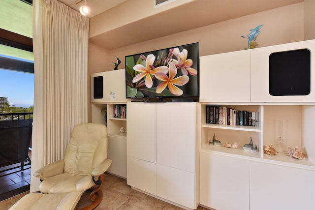 sitting room with light tile flooring