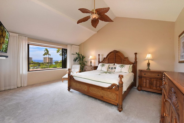 bedroom featuring light carpet, vaulted ceiling, and ceiling fan