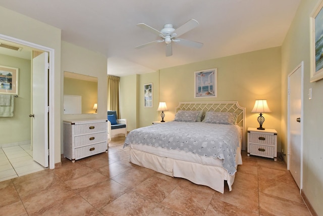 bedroom with ensuite bathroom, ceiling fan, and light tile floors