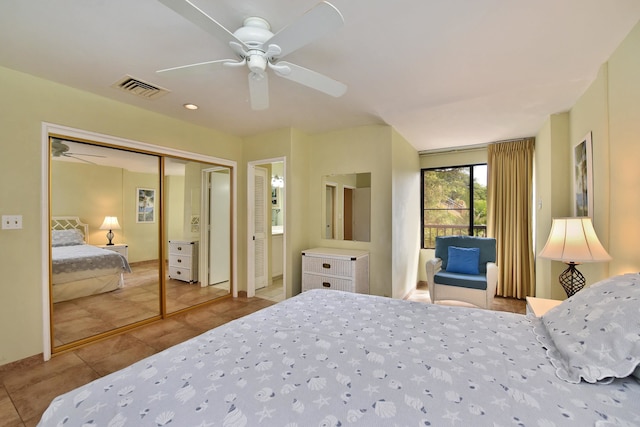 tiled bedroom featuring a closet and ceiling fan