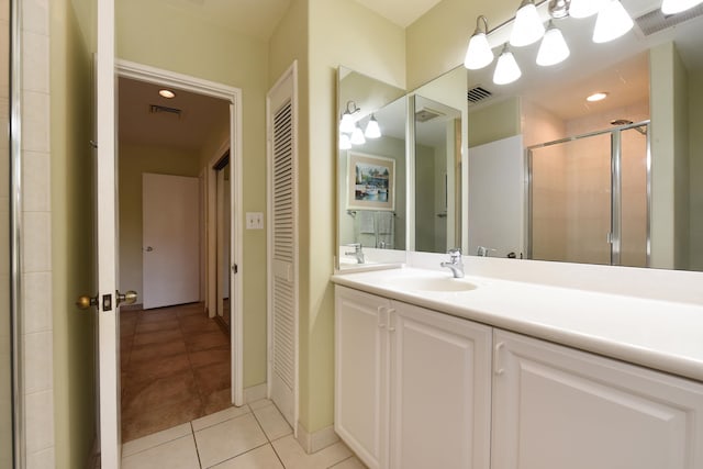 bathroom with tile floors and vanity