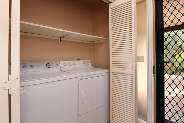 washroom featuring washer and dryer and plenty of natural light