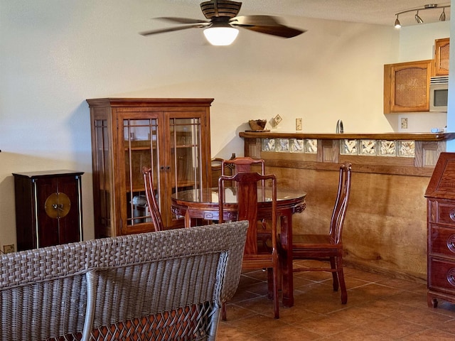 50 Kepuhi Pl Unit 103, Maunaloa, HI 96770 - dining area with ceiling fan and tile patterned floors