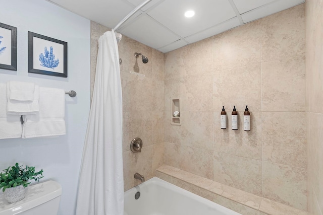 bathroom with shower / tub combo and toilet