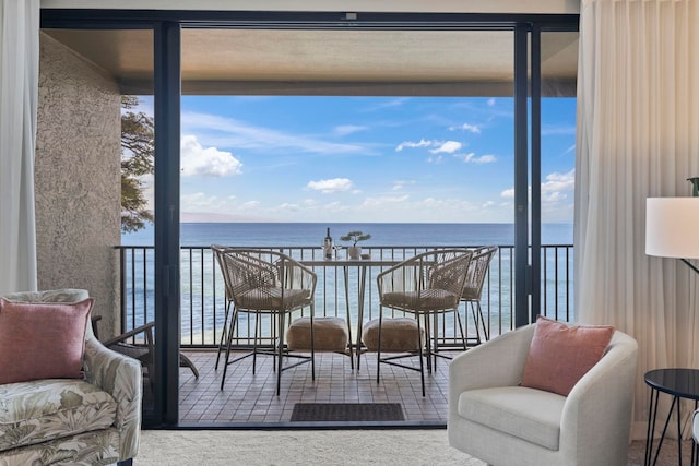 balcony featuring a water view