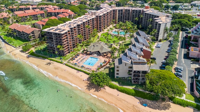 drone / aerial view featuring a water view and a view of the beach