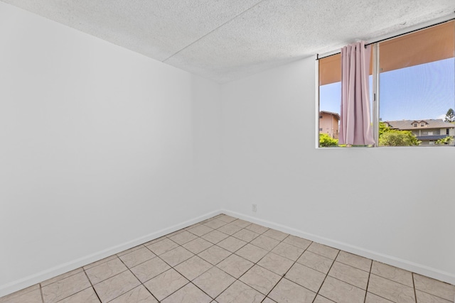 3676 Lower Honoapiilani Rd Unit G302, Lahaina, HI 96761 - empty room featuring baseboards and a textured ceiling