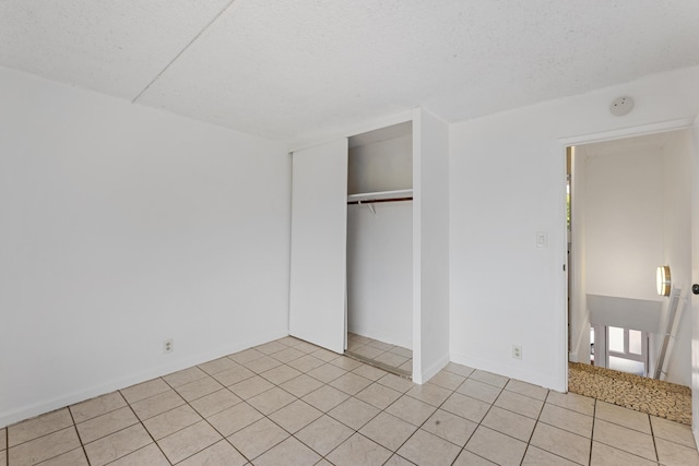 3676 Lower Honoapiilani Rd Unit G302, Lahaina, HI 96761 - unfurnished bedroom with light tile patterned flooring and a closet