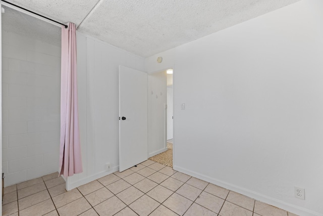3676 Lower Honoapiilani Rd Unit G302, Lahaina, HI 96761 - unfurnished room with light tile patterned floors and a textured ceiling