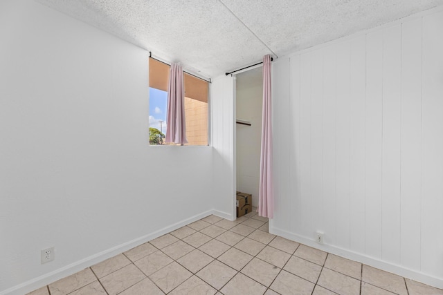 3676 Lower Honoapiilani Rd Unit G302, Lahaina, HI 96761 - unfurnished room with a textured ceiling and light tile patterned floors