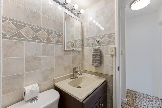 3676 Lower Honoapiilani Rd Unit G302, Lahaina, HI 96761 - bathroom with tile walls and vanity