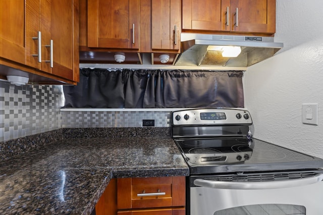 3676 Lower Honoapiilani Rd Unit G302, Lahaina, HI 96761 - kitchen with stainless steel electric stove, under cabinet range hood, decorative backsplash, and brown cabinets