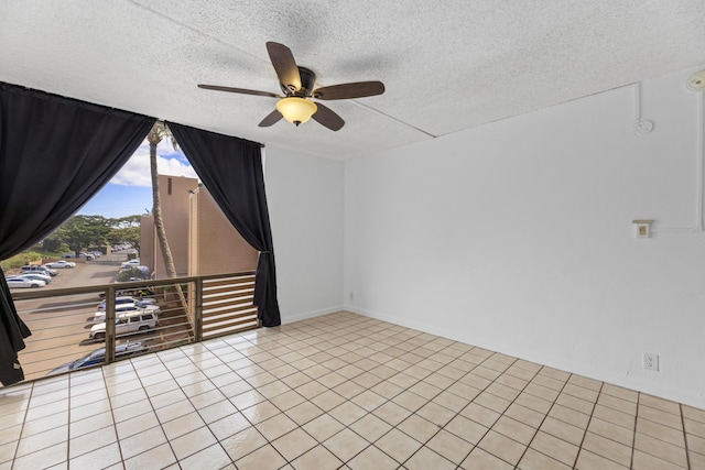 3676 Lower Honoapiilani Rd Unit G302, Lahaina, HI 96761 - spare room featuring a ceiling fan, a textured ceiling, and light tile patterned flooring